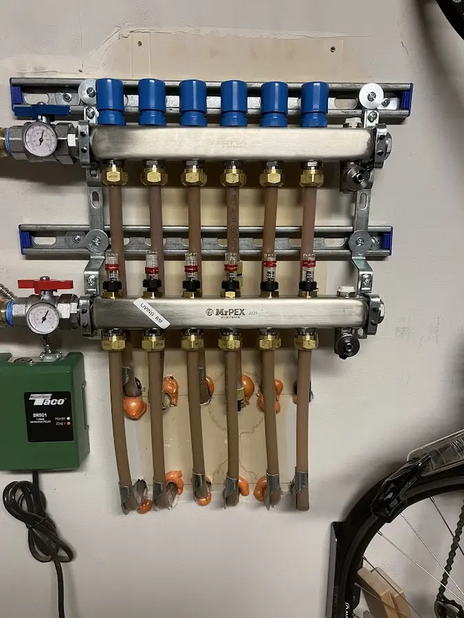 Plumber performing Water Heater Repair at a residential property in Pontiac